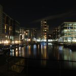 32924636_the-lock-entrance-and-moorings-at-clarence-dock-in-leeds-at-night-with-buildings-of-the-development-reflected-in-the-water-and-glowing-street-lights-and-boats